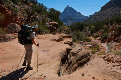 Rob hikes down the north arm of Unkar with Vishnu Temple visible in the distance