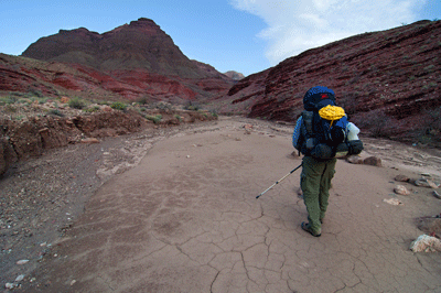 Dennis hikes upstream in the dry bed of Basalt Canyon