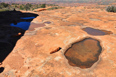 Partially filled water pockets below Monument Point